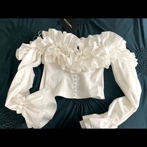 White ruffle Hem off the shoulder never worn with tags on, super on the side.